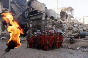 An activist holds a burning torch near children carrying banners inside a cage during a protest against forces loyal to Syria's President Bashar al-Assad in Douma
